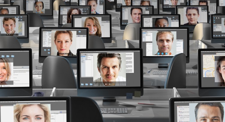 Many computers with peoples faces on each screen. Hybrid and remote work concept.