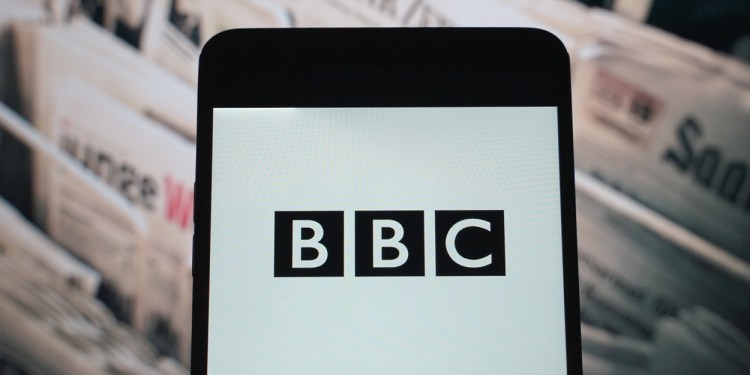 The logo of BBC is seen displayed on a smartphone