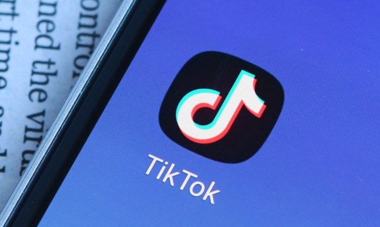 TikTok logo displayed on a smartphone.