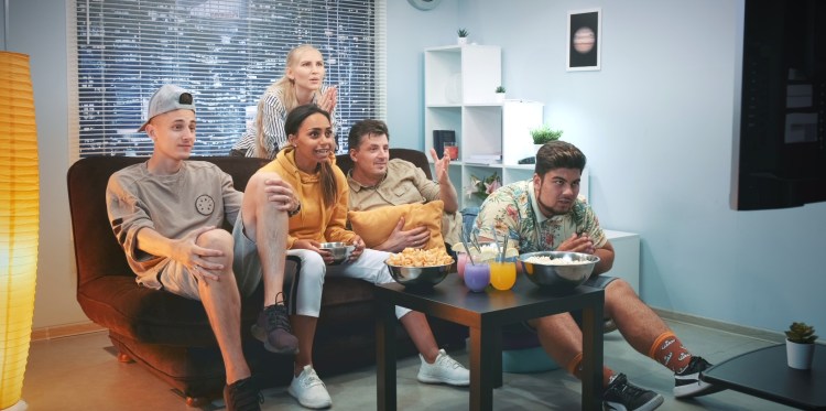 Group Of friends watching sports on TV 