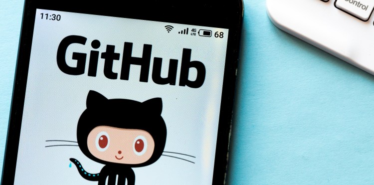 A GitHub logo seen displayed on a smartphone.