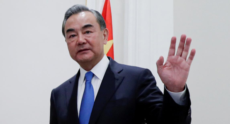FILE PHOTO: China's State Councillor Wang Yi gestures as he meets with Canada's Foreign Minister Francois-Philippe Champagne in Rome, Italy, August 25, 2020.