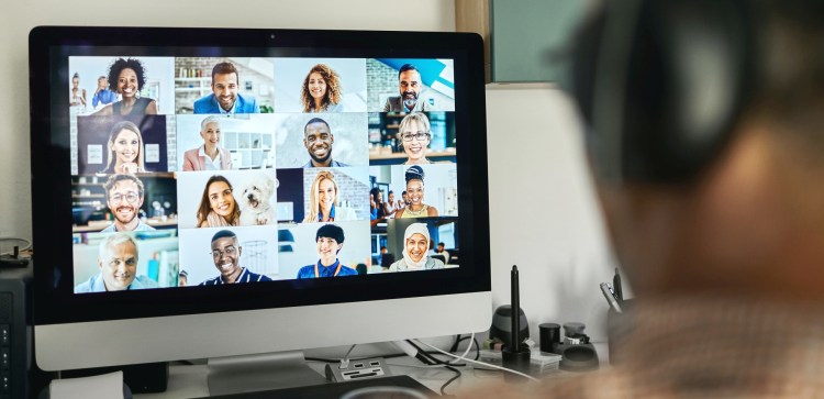 Businessman working with colleague through video conferencing -