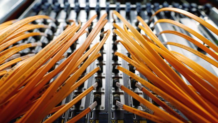 Optical fibre cables are seen in a telephone exchange in Rome, Italy December 20, 2013. 