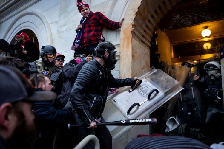 WASHINGTON, DC - JANUARY 6: Trump supporters clash with police and security forces as people try to storm the US Capitol on January 6, 2021 in Washington, DC. (photo by Brent Stirton/Getty Images)