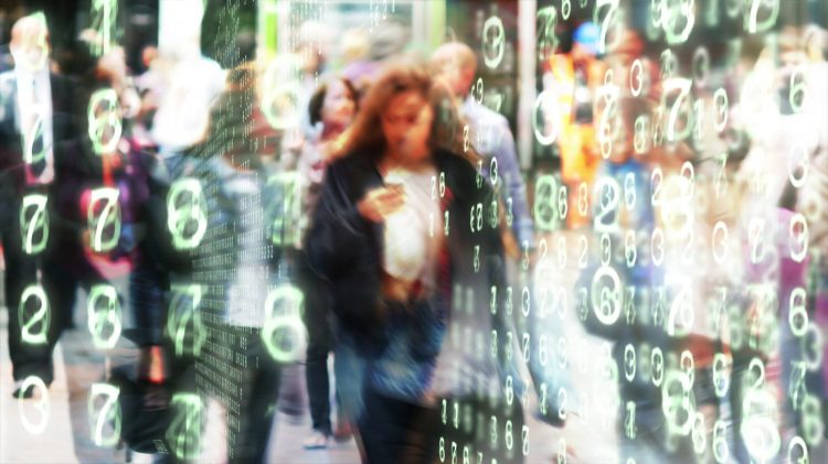 Woman looking at her phone surrounded by glowing numbers in a stylized city environment.