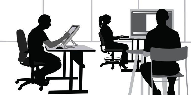 Programmers working in an open office