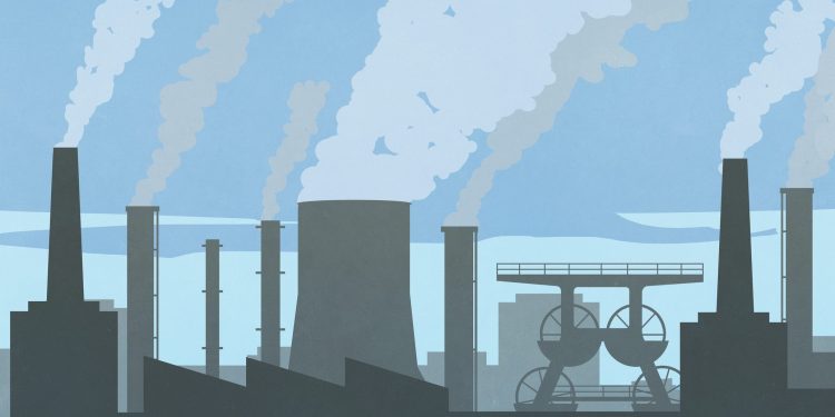 Pollution smoke emitting from factory smokestacks