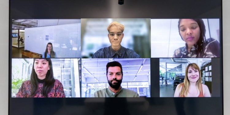 Image of remote work employees holding a meeting. Cybersecurity is a major factor when it comes to remote work.