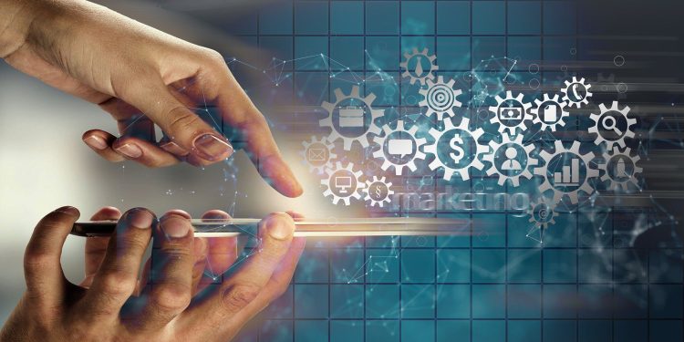 Graphic of a hand interacting with a smartphone and gears of icons for finance, email, charts, search, and other digital activities in the background