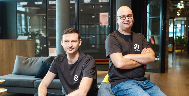 Spacelift COO Paweł Hytry and CEO Marcin Wyszynski, pose in company t-shirts.