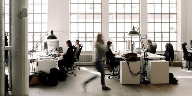 Male and female professional coworkers working in office