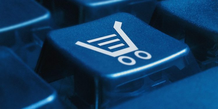 Image of a single button on a keyboard with the image of a shopping cart on it.