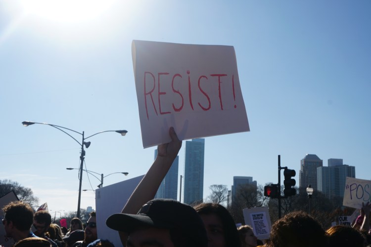 People On Protesting On Street In City