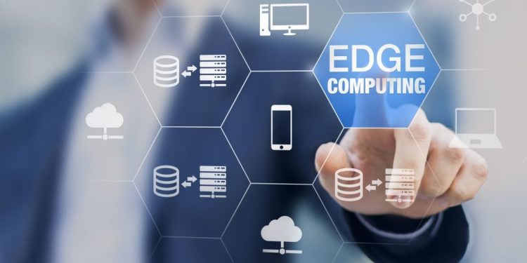 Image of edge AI computing with series of other interfaces (such as cloud, mobile, etc.) set against a backdrop of a man pressing a finger to a touchscreen.