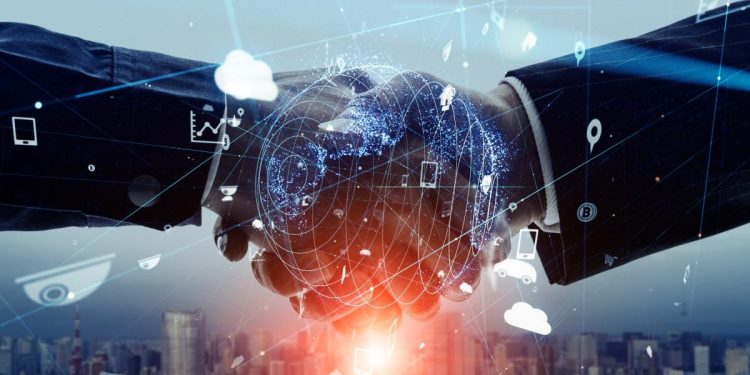 Image of two hands shaking in a clear investment or venture capital agreement. Overlaid is an image of a digital world.