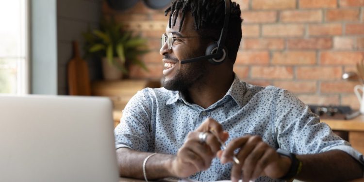 Image of IT worker behind a computer.