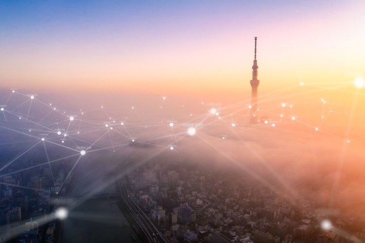 Aerial view of Tokyo city with networking connections line,global communications and Technology concept,Data and smart city and Internet of Things  concept,Futuristic concept