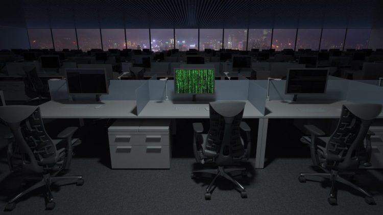 Computer being hacked in dark office