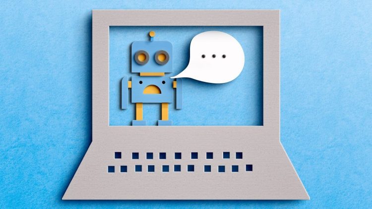 Image of a robot with a speech bubble in a cutout of a laptop. Chatbot marketing concept.