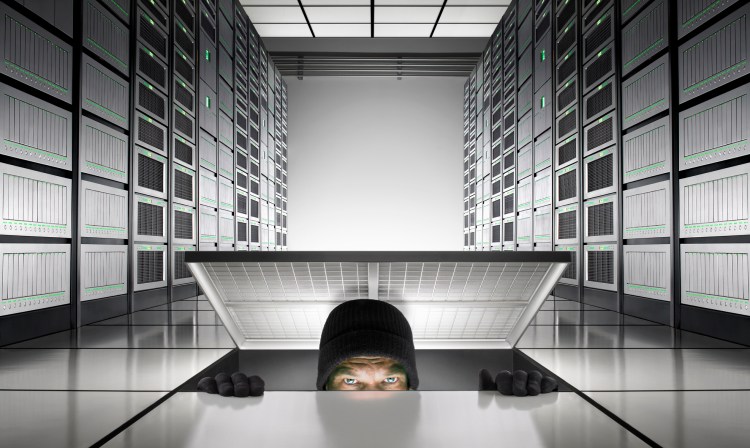 A person breaking through the floor of a network server room
