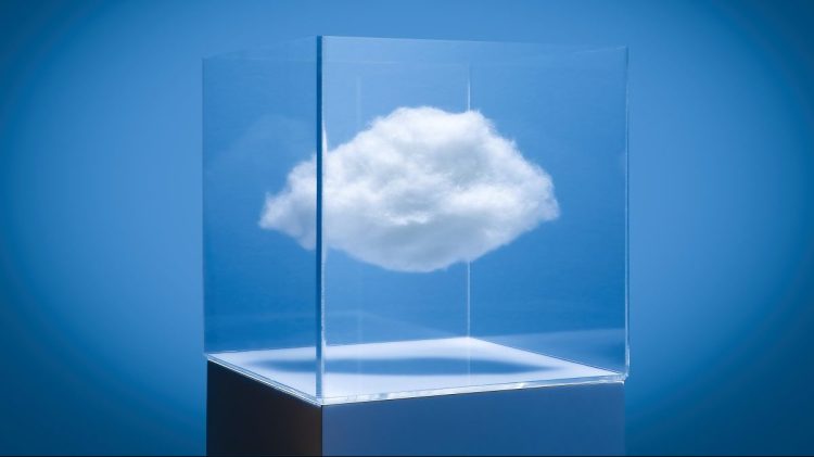 White puffy could in a transparent box on white pedestal, blue studio background