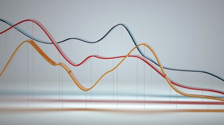 Digital generated image of abstract multi colored curve chart on white background. Indicative of graph data.