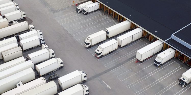 Loading docks with lots of trucks. 