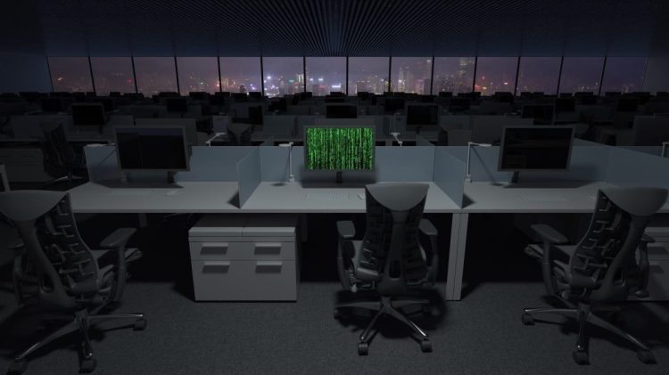 Computer being hacked in dark office