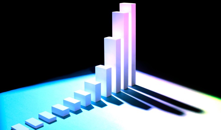 Growth of startups and data concept: white bars arranged in ascending order, creating graph showing steady positive growth with long shadows, black background