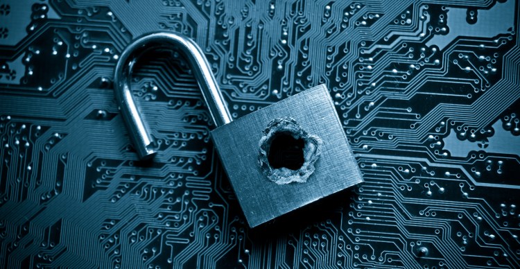 Security lock with a hole on computer circuit board - cybersecurity concept