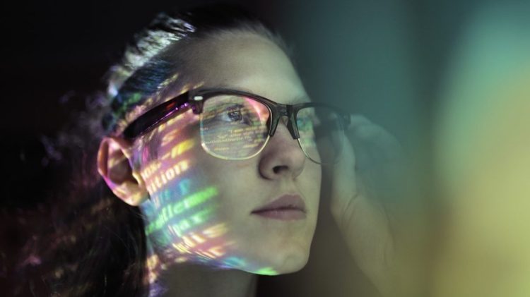 Dev looking at code on a computer screen