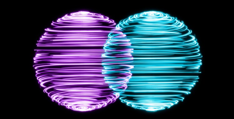 Spinning Light Trails Spheres Intersection on Black Background.