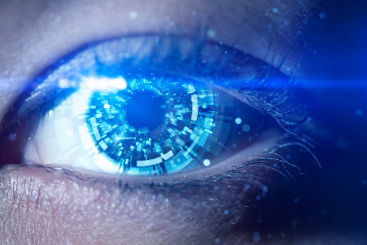 Young woman's eye and futuristic circular element.