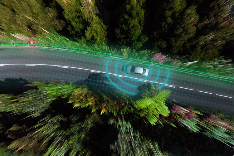 Smart car evaluating the road with sensors and futuristic technology.