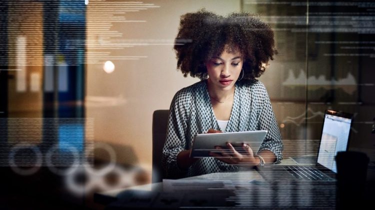 Young digital marketer using enterprise analytics to make adjustments to the code