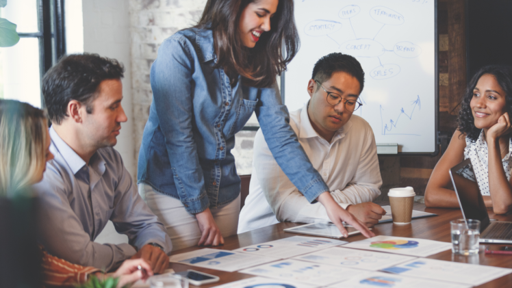 Data management specialists discussing at a workplace meeting