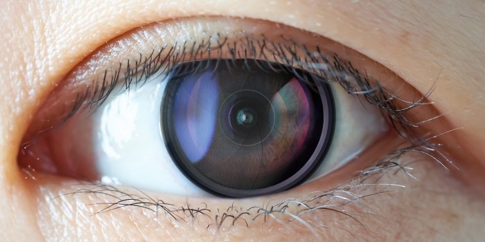 Closeup of camera len inside the women eye , futuristic digital vision augmented reality technology concept