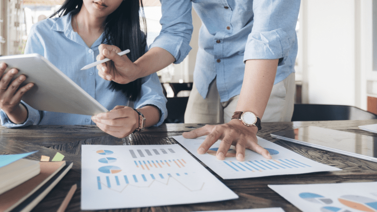 Data managers discussing results across a conference table