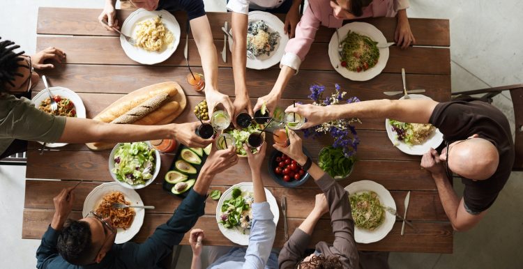 A group of people gathered around a table. ITOps thankful concept