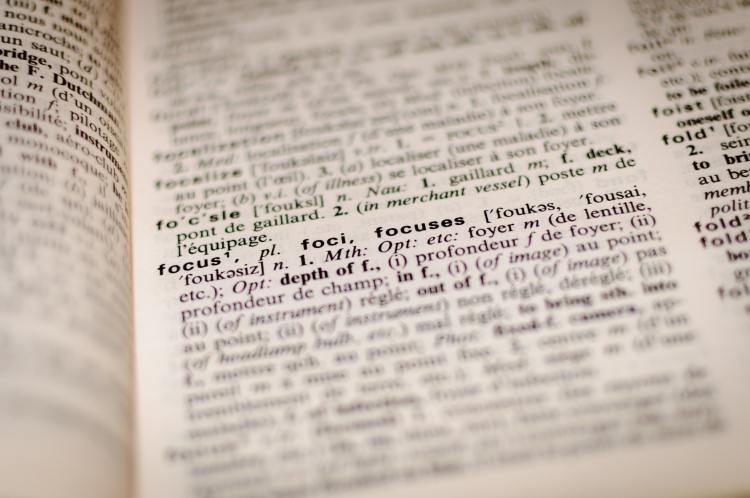 photo of dictionary page with the word "focus" in focus