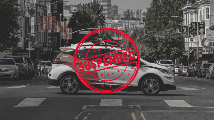 Cruise autonomous vehicle image with a stamp reading 'Suspended' atop it.
