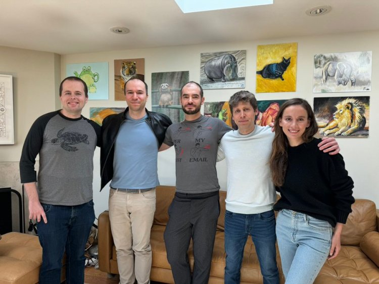 Sutskever pictured (center) with other OpenAI team members.